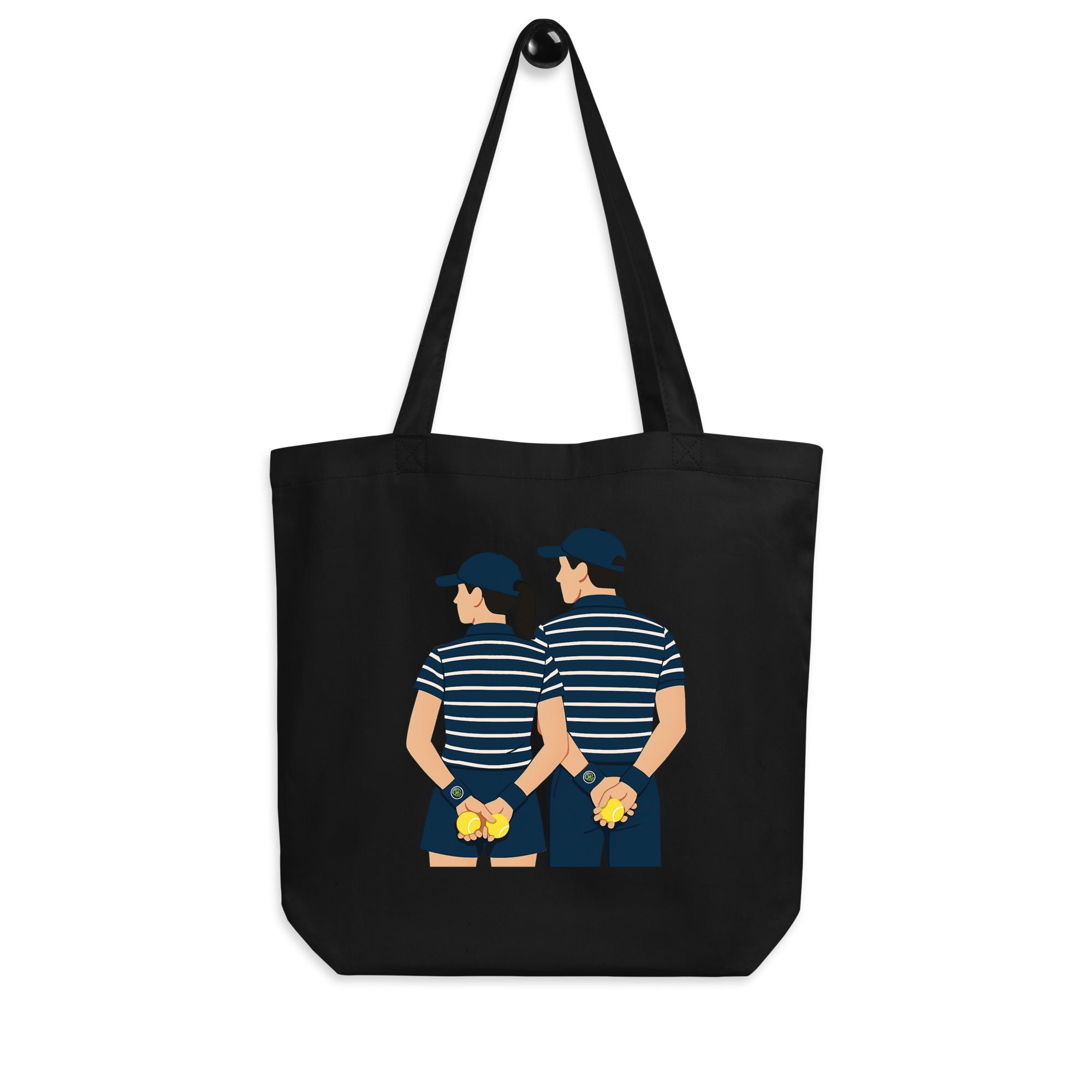 Black organic cotton tote bag featuring “Ball kids” graphic – front hanging display view