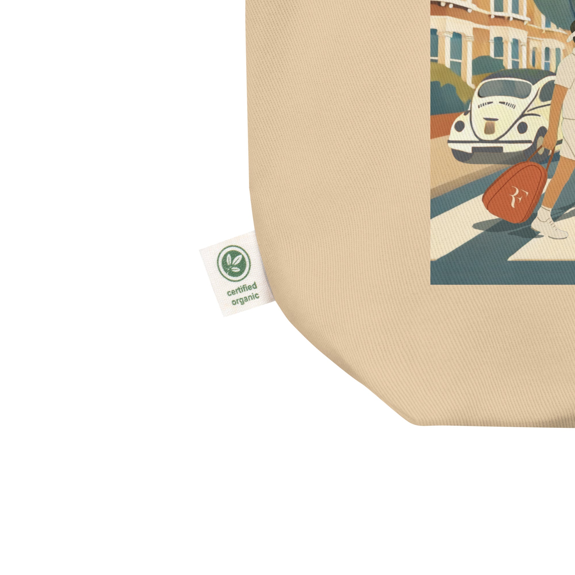 Product Close-up detail: Oyster (Beige) organic cotton tote bag showing “certified organic” side tag and a corner of the “Big 4 Crossing” illustration print